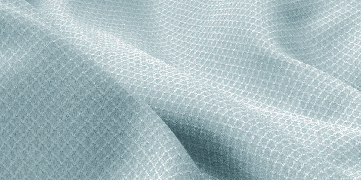 Close-up of Fractel Aero3D running fabric with a raised 3D mesh texture in pale blue