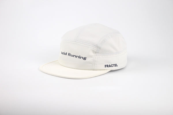 An off-white 5-panel camp cap with black embroidered text reading 'Acid Running' on the front and 'FRACTEL' on the side, shown against a plain white background.