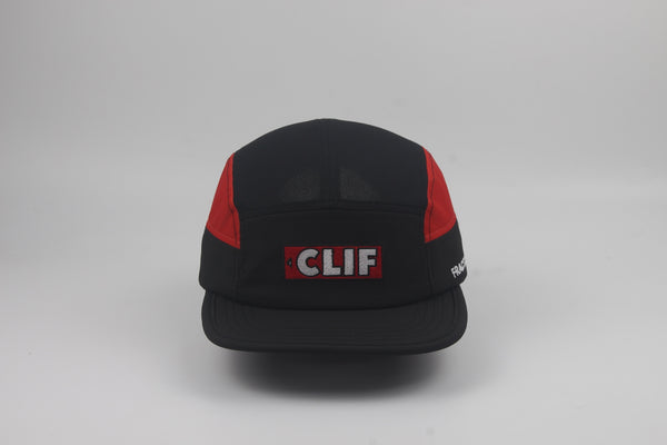 A black and red M-Series cap with a prominent red and white 'CLIF' logo patch on the front, photographed against a neutral gray background.