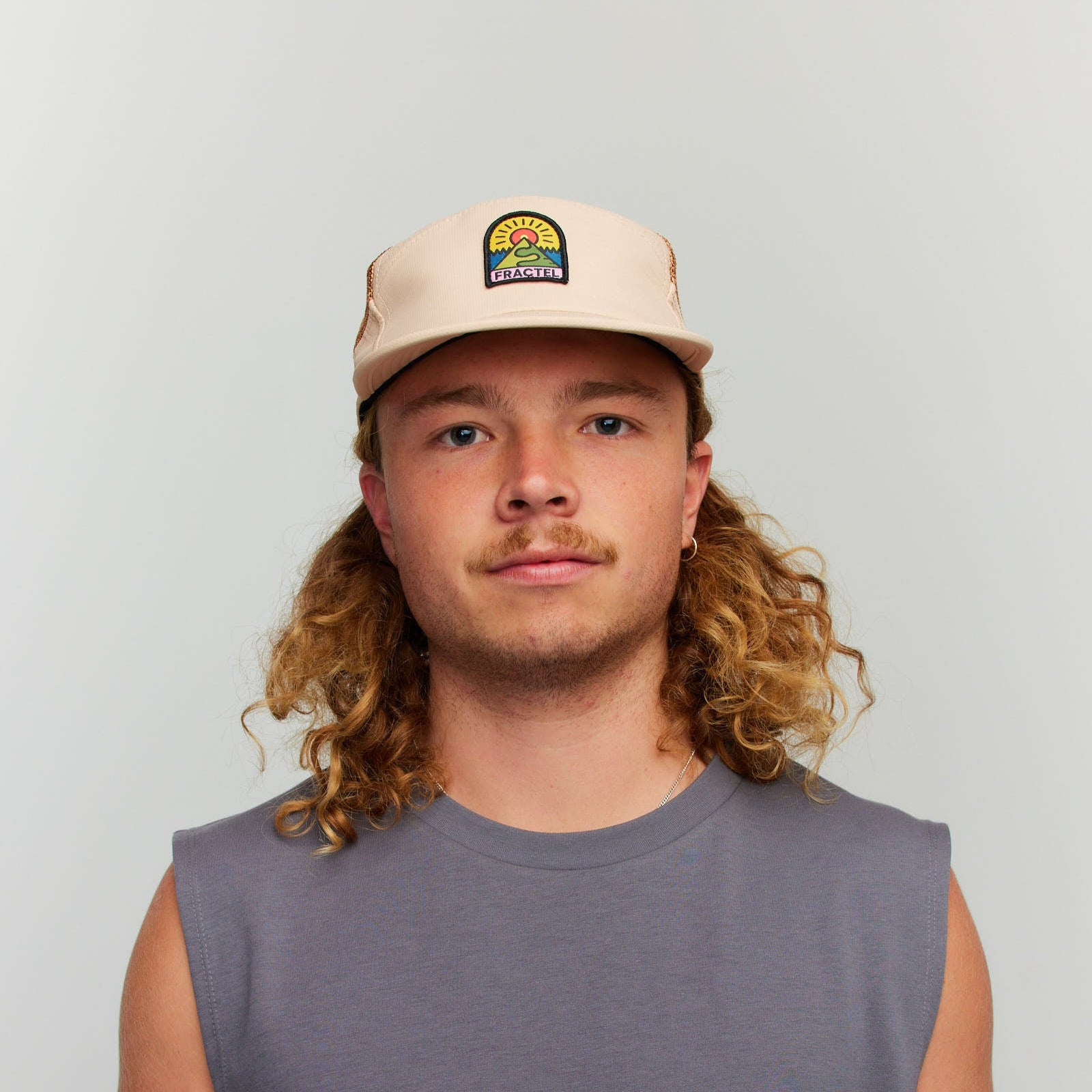 Runner wearing T-SIERPINKSKI Trucker Hat outdoors