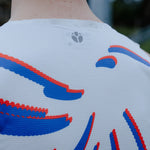 Close-up of a singlet with blue and red designs on a blurred background