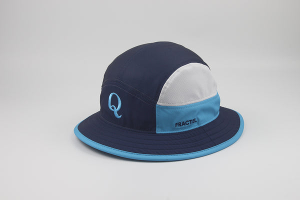 A colorblock bucket hat by Fractel, featuring a navy blue crown, a white back panel, a light blue side panel with the brand name, and a light blue brim with a navy blue edge.