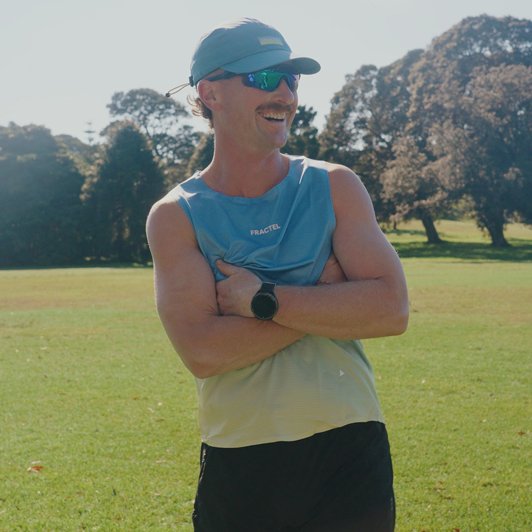 Man wearing the Fractel V-MACAW Performance Singlet, front view