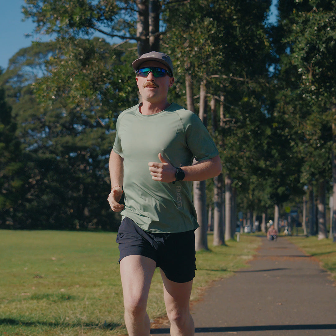 Man wearing the Fractel V-PINE Performance Tee, lifestyle photo
