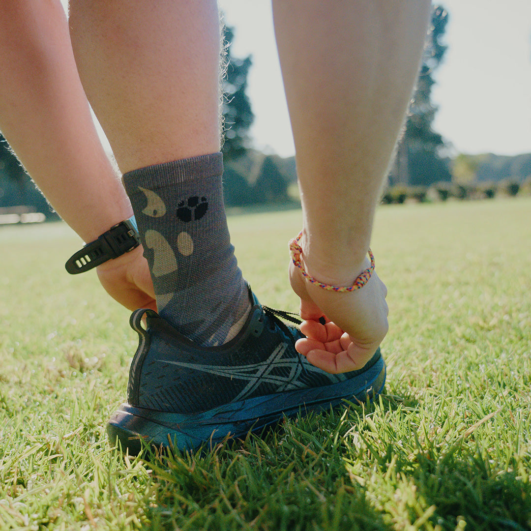 Person wearing Fractel V-UNFURL Performance Crew Socks, lifestyle photo