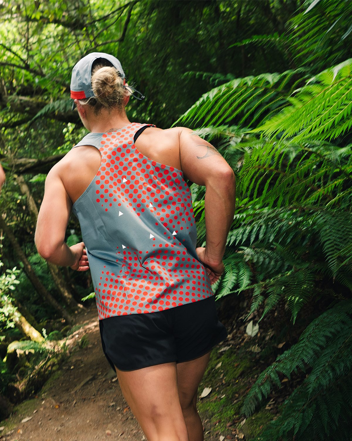 Butterfly effect running collection singlet worn on a fern trail