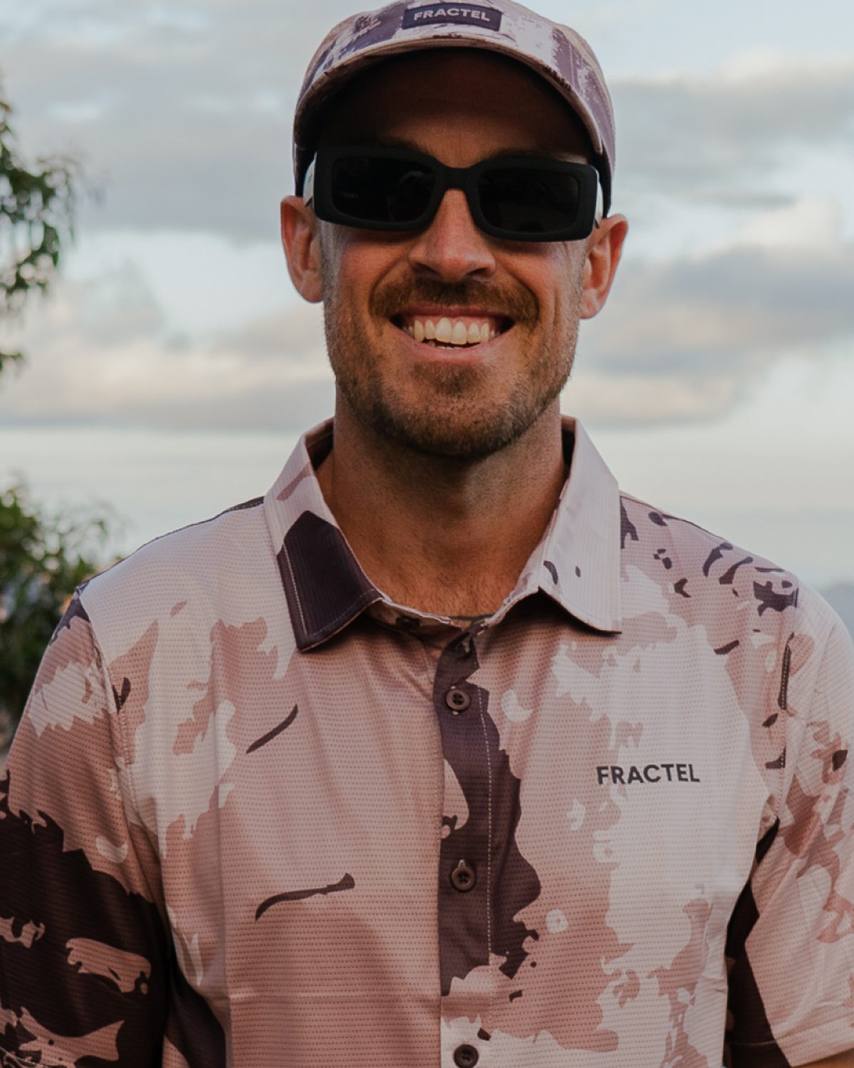 Fractel collared adventure shirt in a printed pattern worn at a lookout