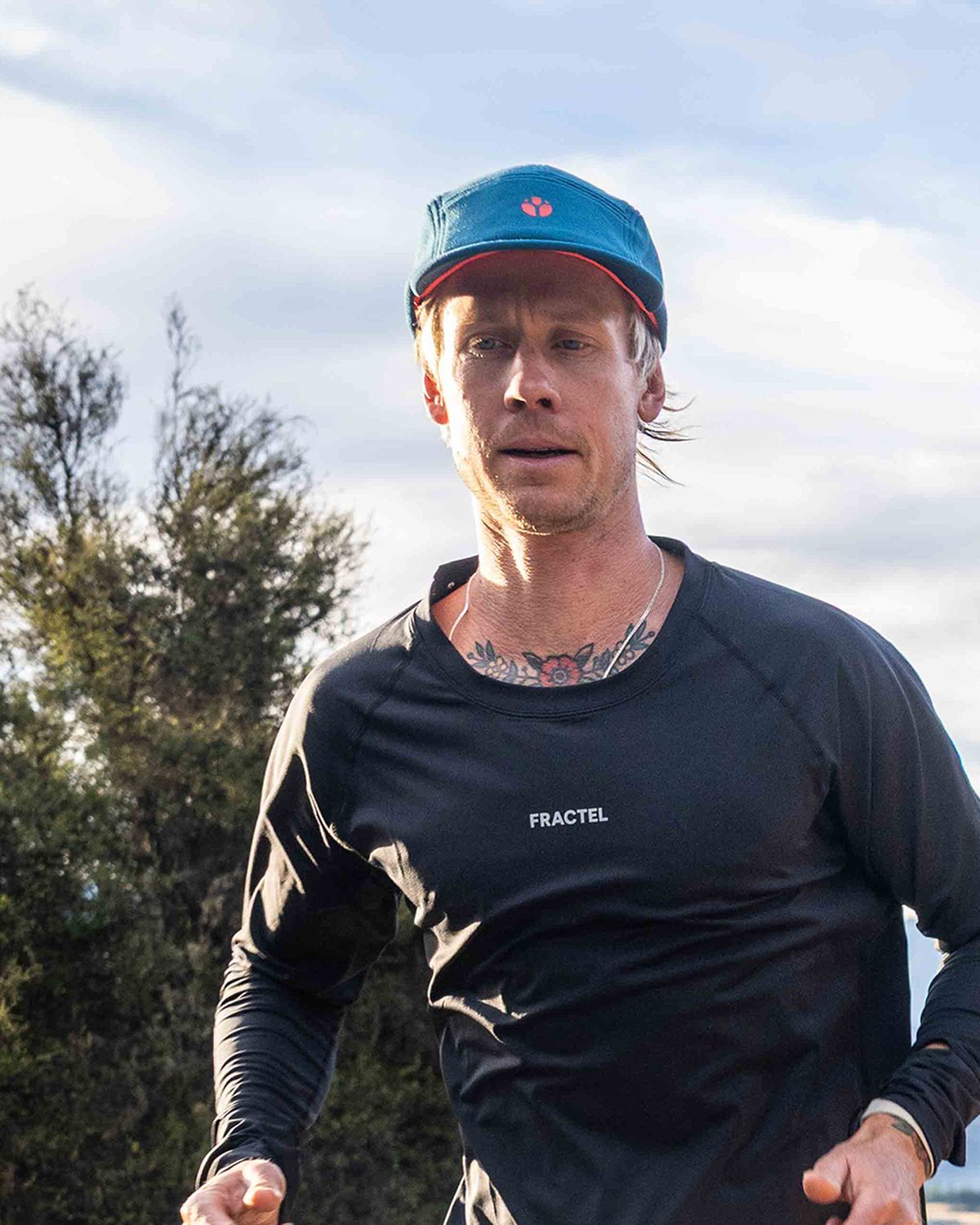 Black Fractel long sleeve running shirt worn on a mountain run