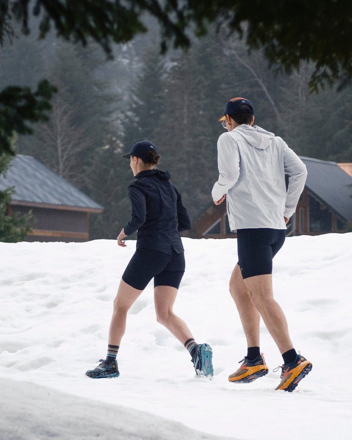Fractel winter running cap worn by a runner in the snow