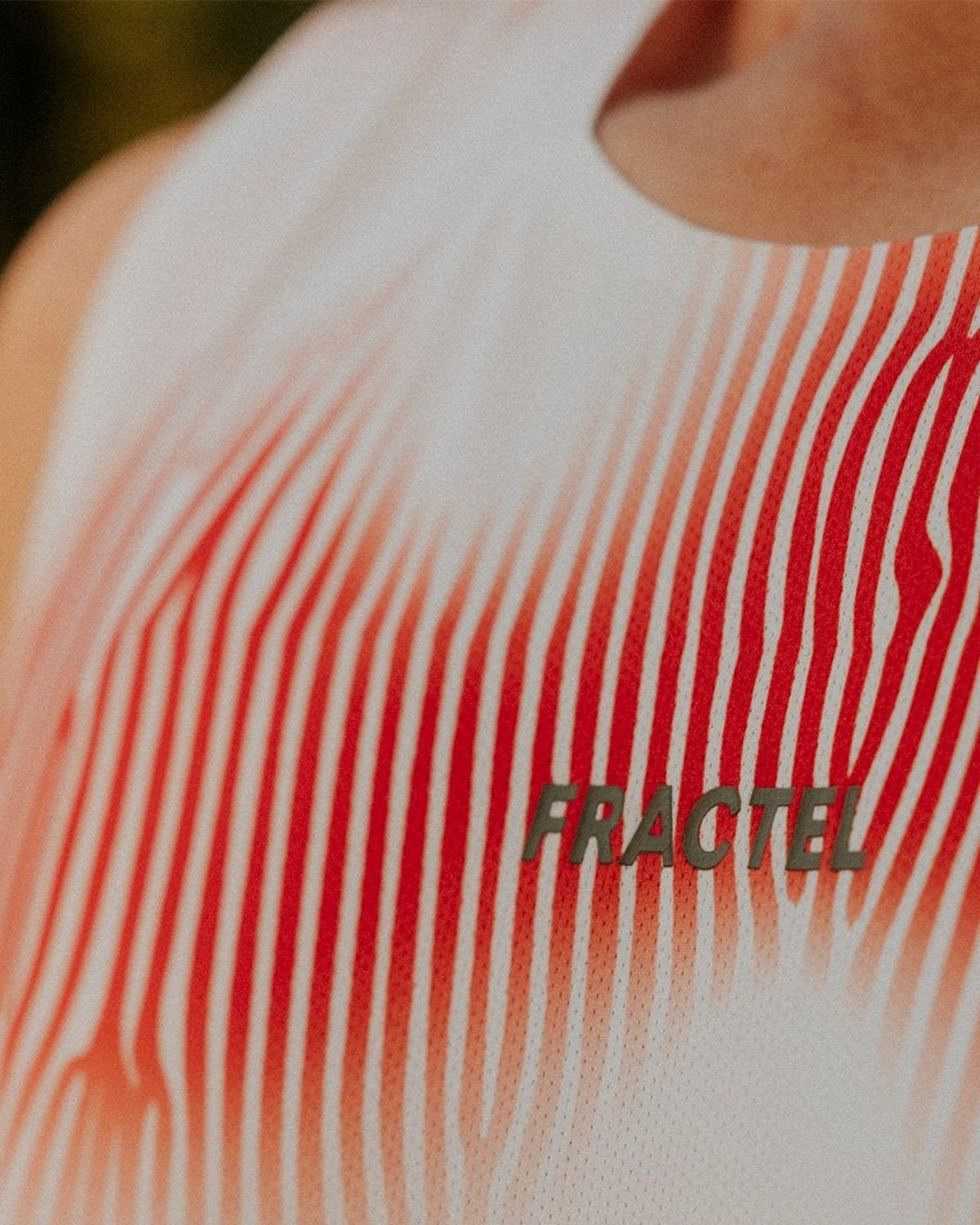 Fractel running singlet in white with a red gradient print
