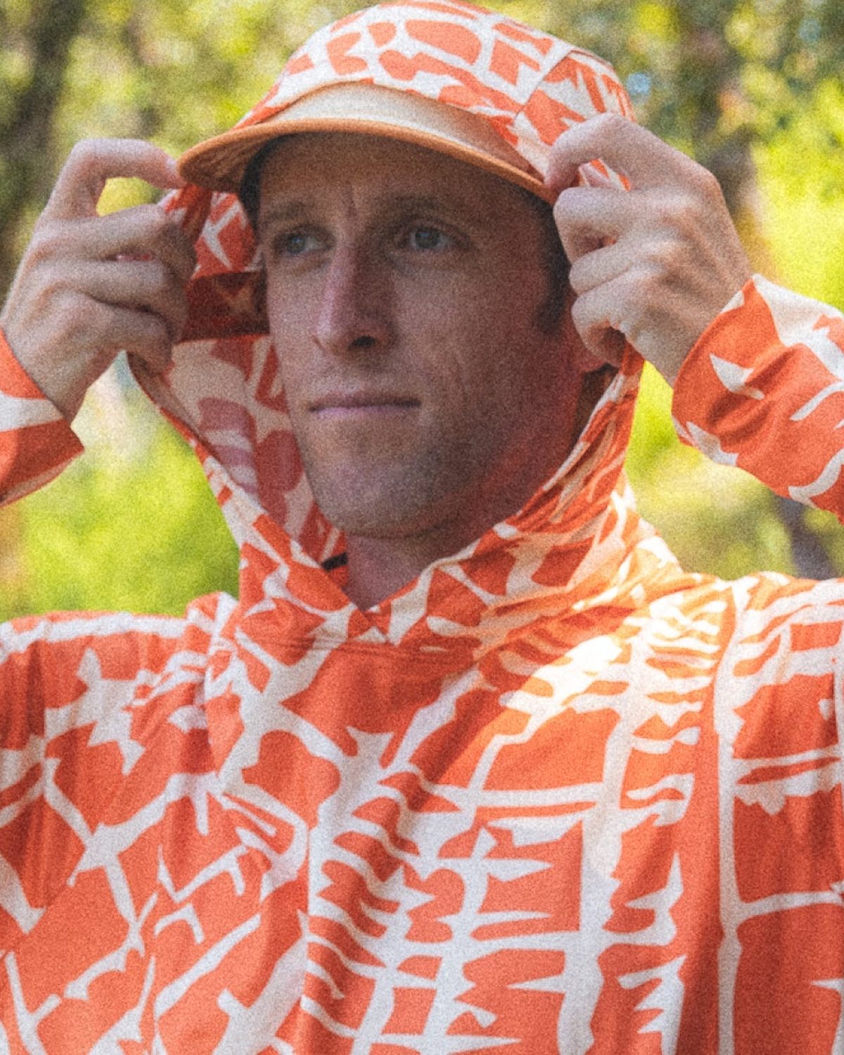 Fractel UPF 50+ sun hoodie in an orange and white print